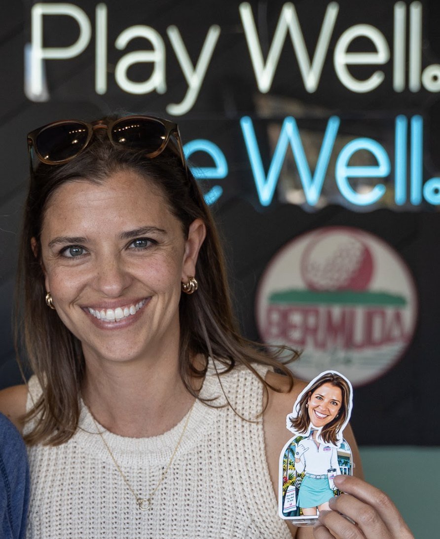 Guest smiling with her TinyTwin at the Bermuda Club event