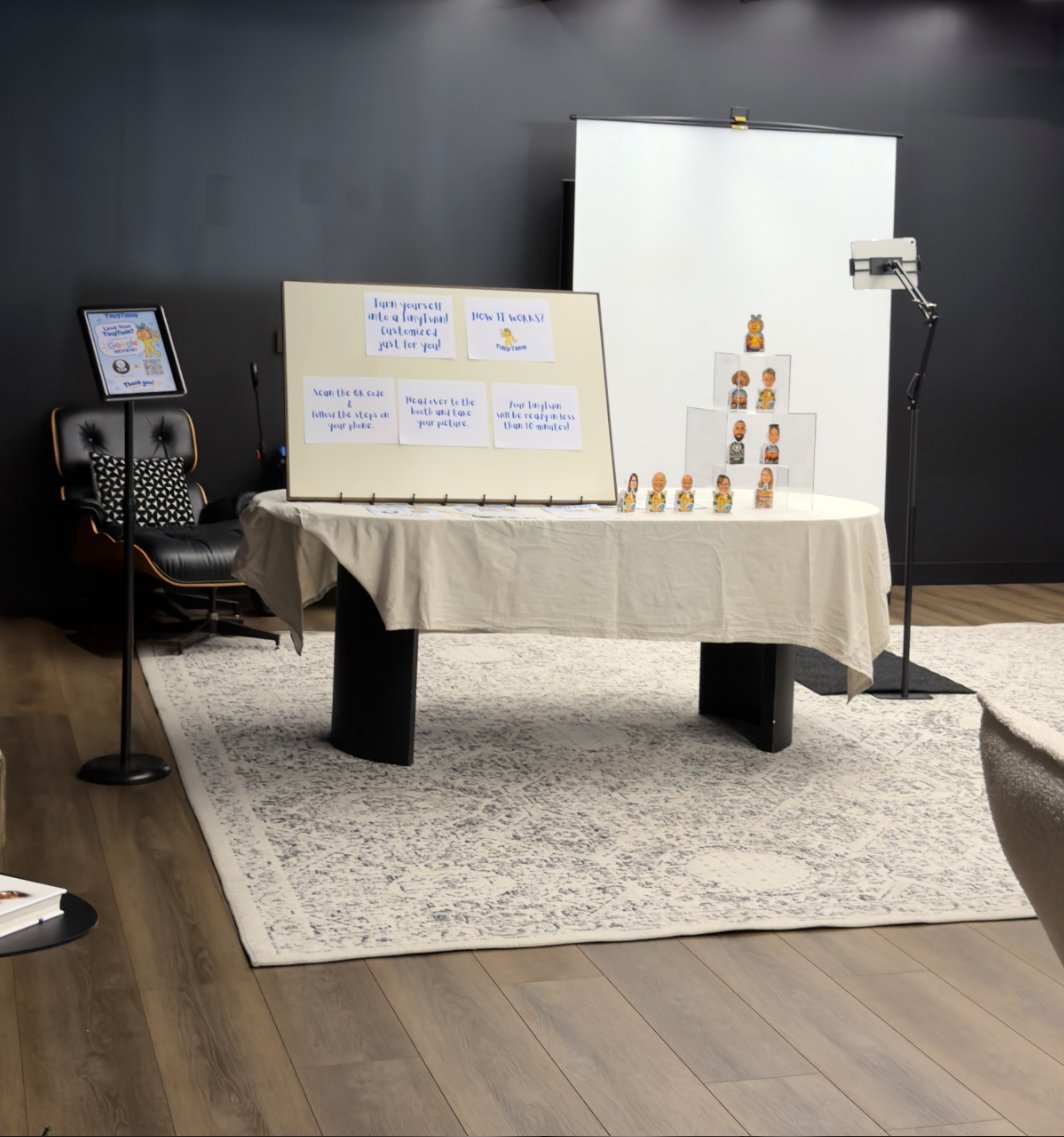 The TinyTwin booth: photo station, backdrop and TinyTwin display